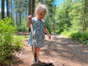 young girl walking on path