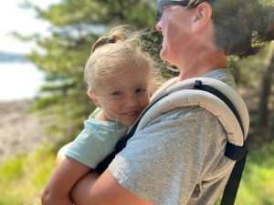 Mom with young child outdoors