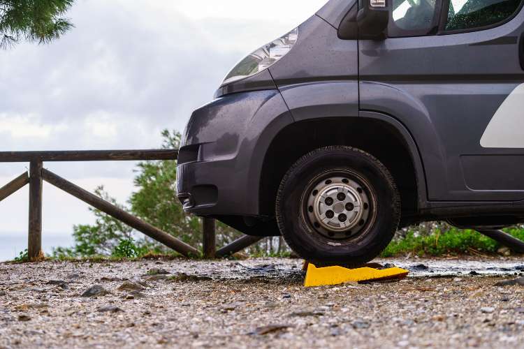 Camper van parked on rv leveling blocks