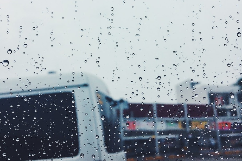 unfocused side img rv van parked in the rain