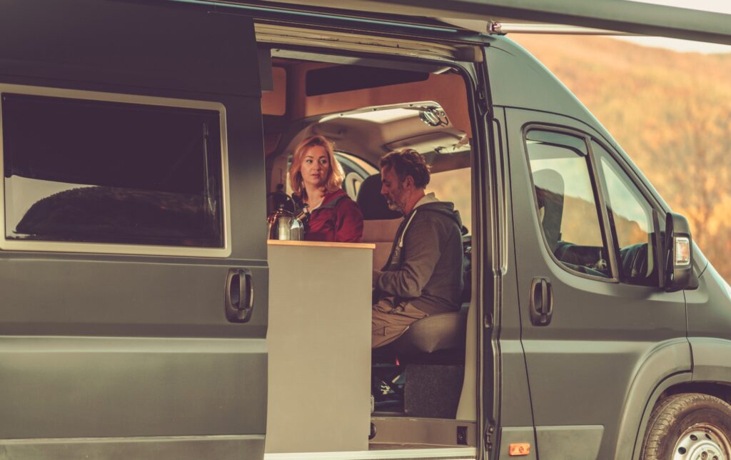 couple traveling in Class B RV